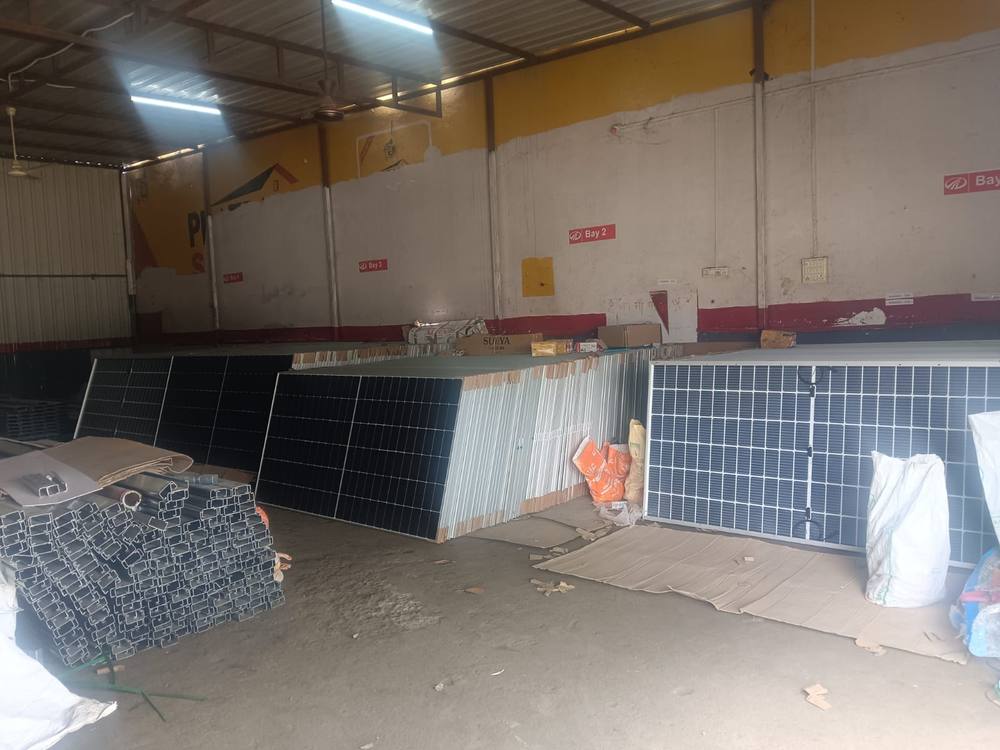 WattPick Solar warehouse with stocked modules and mounting structures