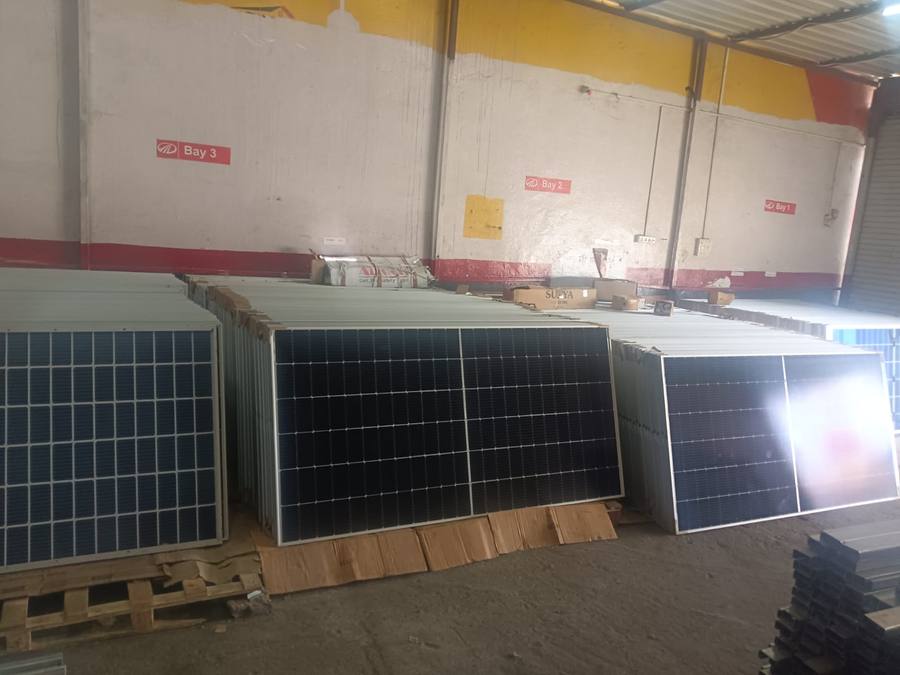 Stacked solar modules in WattPick Solar warehouse