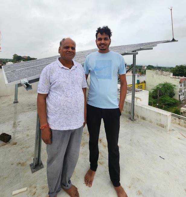 WattPick Solar team with customer on rooftop at Manasa